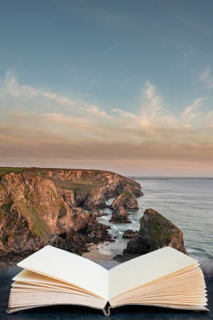 Stunning landscape image during golden hour on Cornwall coastline at Bedruthan Steps coming out of...
