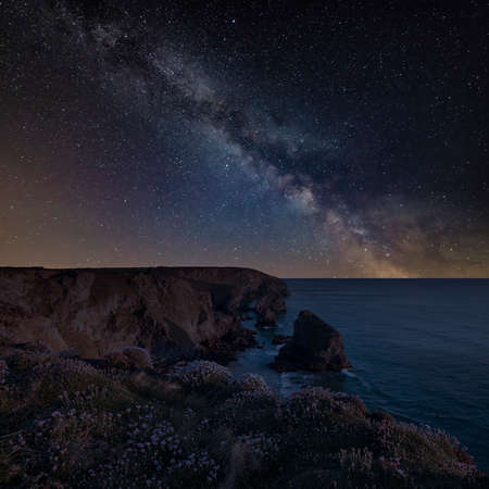 Stunning landscape image during golden hour on Cornwall coastline at Bedruthan Stepsの写真素材
