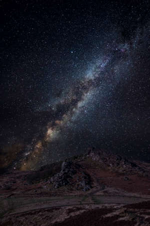 Stunning Peak District Winter landscape of Ramsaw Rocks with digital composite Milky Way night skyの写真素材