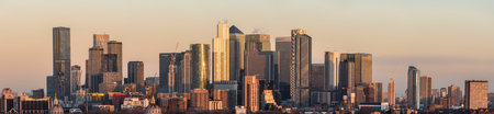 LONDON, JANUARY 30, 2022 - Stunning sunrise view of Canary Wharf in London at sunrise with beautful...