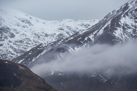 Beautiful Winter landscape image of peak of Stob Dearg Buachaille Etive Mor in Glencoe, Rannoch Moorの写真素材