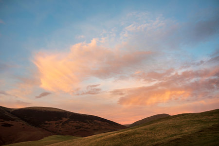 Beautiful Winter sunset landscape over Latrigg Fell in Lake Districtの写真素材