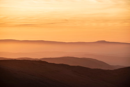 Lovely Winter landscape view from Red Screeds across misty layers of mountains Ill Bell, Stony Cove...