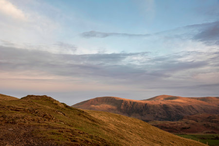 Wonderful sunset landscape image of view from Latrigg Fell towards Great Dodd and Stybarrow Dodd in Lake Districtの写真素材