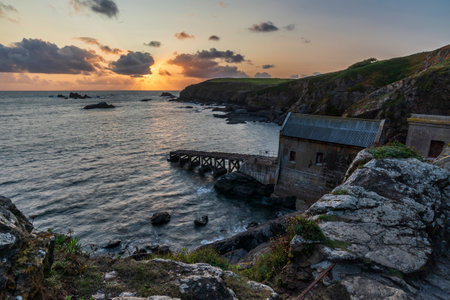 Beautiful Summer sunset landscape image of Lizard Point in Cornwall UK during colourful duskの写真素材