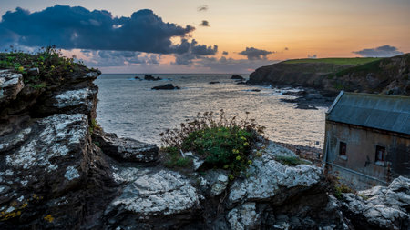 Beautiful Summer sunset landscape image of Lizard Point in Cornwall UK during colourful duskの写真素材