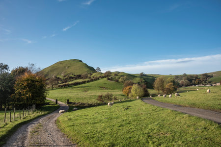 Beautiful landscape image of view along country lanes towards Chrome Hil in Peak District Nationa lPark in Englandの写真素材
