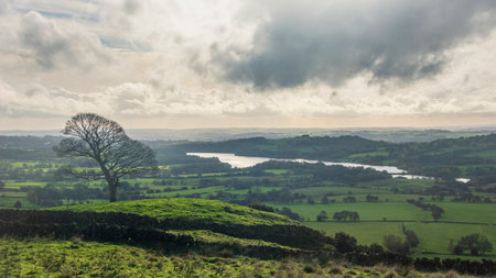 Beautiful wide vista landscape image of English countryside in Peak District National Park