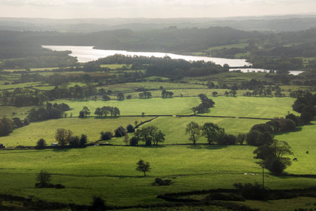 Beautiful wide vista landscape image of English countryside in Peak District National Parkの写真素材