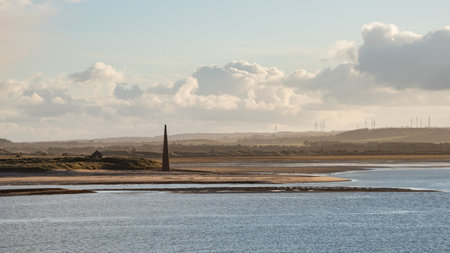 Stunning landscape image of Lindisfarne, Holy Island in Northumberland England during moody Winter dayの写真素材