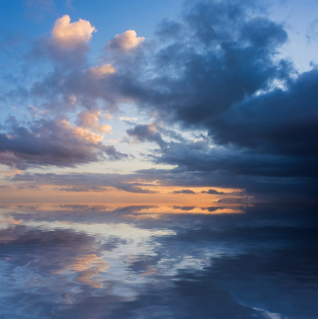 Beautiful dramatic colorful stormy landscape sunset sky with lovely moody contrast in the cloudsの写真素材