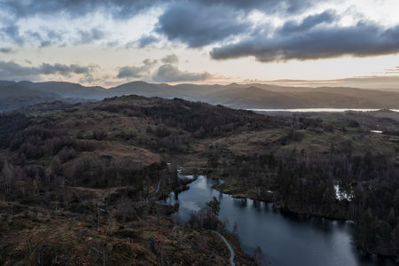 Stunning aerial drone landscape image of Lake District during Spring vibrant sunsetの写真素材