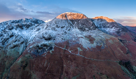 Beautiful panorama landscape aerial drone image of Butter and surrounding snowcapped mountains in Lake Districtの写真素材