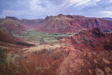 Beautiful atmospheric aerial drone Autumn landscape image of Langdale Pikes in Lake Districtの写真素材