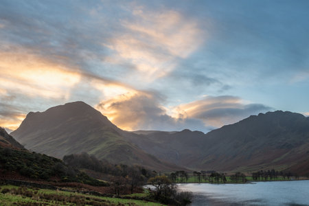 Beautiful Autumn sunrise landscape image of Buttermere in Lake Districtの写真素材