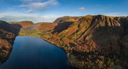 Stunning aerial drone landscape in Autumn of mountains around Buttermere in Lake District at sunriseの写真素材