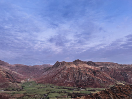 Stunning aerial drone landscape image of Blea Tarn and Langdale Valley in Lake District during vibrant Autumn sunriseの写真素材