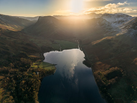 Stunning aerial drone landscape in Autumn Winter of snowcapped mountains around Buttermere in Lake District at sunriseの写真素材