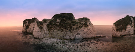 Beautiful aerial drone atmospheric moody landscape of cliffs on Jurassic Coast ni England during...