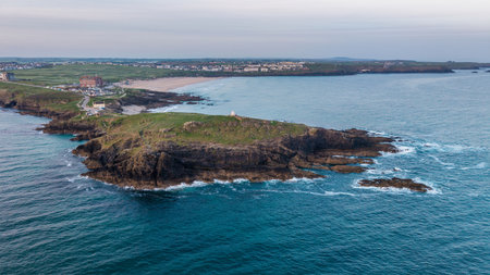 Stunning aerial drone landscape image of Towan Headland in Cornwall during beautiful Summer morningの写真素材