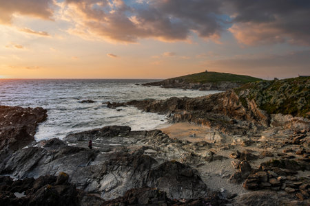Stunning sunset over Towan Headland in Cornwall England during lovely Summer eveningの写真素材
