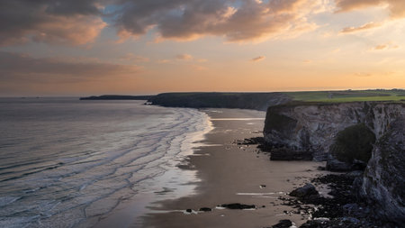 Sunrise landscape image of Lucky Elephant Rocks near Newquay in Cornwall England in Summerの写真素材