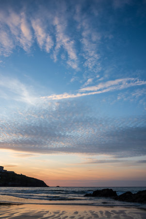 Stunning landscape travel image of Newquay beach in Cornwall during beautiful Summer sunsetの写真素材