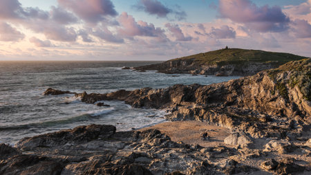 Stunning sunset over Towan Headland in Cornwall England during lovely Summer eveningの写真素材