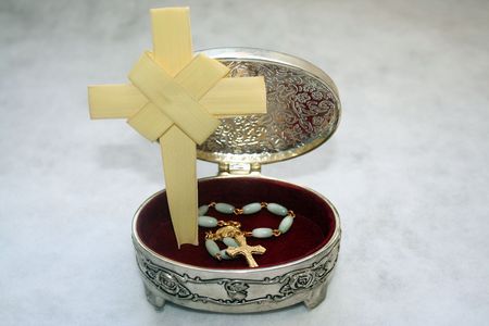 Jewelry with a rosary and a blessed palm
