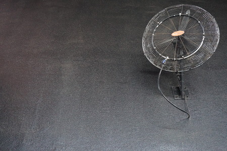 Wall mounted ventilator on the black wall.の写真素材