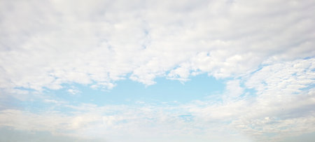 Panorama light blue sky background with full of cloudsの写真素材