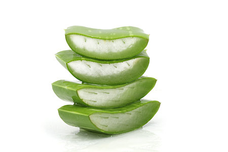 Aloe vera leaves with sliced isolate on white backgroundの写真素材