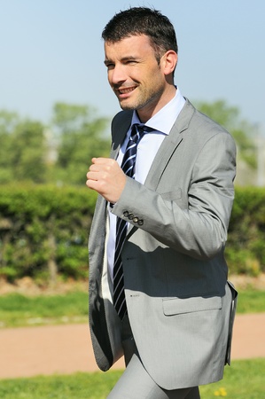 Portrait of a businessman outdoor with winner spiritの写真素材