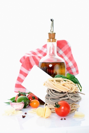 tasted italian pasta with food ingrediens for cooking and message cardの写真素材