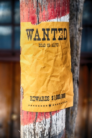 vintage wanted poster in a gost townの写真素材