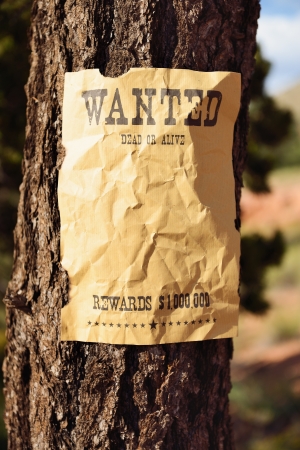 vintage wanted poster in a gost townの写真素材