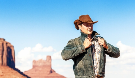 attractive cow boy in famous Monument valley National tribal park, USAの写真素材