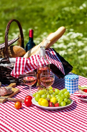 tasted picnic on the grass near a lakeの写真素材