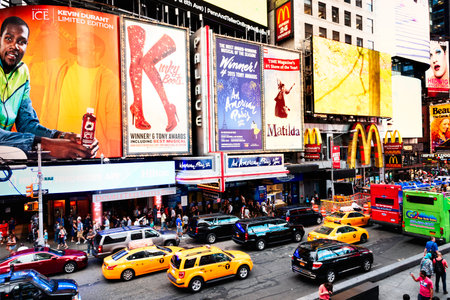 NEW YORK CITY -JULY 09: Times Square, featured with Broadway Theaters and animated LED signs, is a...