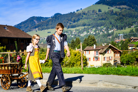 Charmey, Fribourg, Switzerland - 26 September 2015 : Farmers with a herd of cows on the annual transhumance at Charmey near Gruyeres, Fribourg zone on the Swiss alpsのeditorial素材