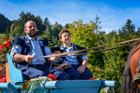 Charmey, Fribourg, Switzerland - SEPTEMBER 26 2015 : Farmers on the annual transhumance at Charmey near Gruyeres, Fribourg zone on the Swiss alpsのeditorial素材