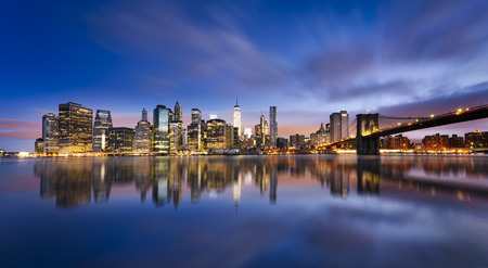 New York City - beautiful sunrise over manhattan with manhattan and brooklyn bridge USA