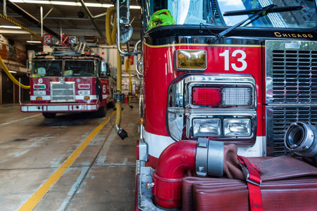 CHICAGO, ILLINOIS, USA - OCTOBER 10, 2018: The fireman's clothes by the real squad fire truck in...