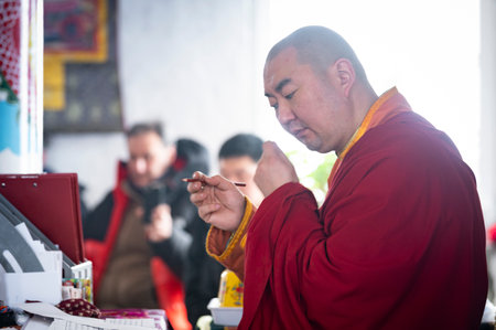 Naryn-Acagat temple, Ulan Ude, Siberia, Russia - March 09, 2020 : Buddhist monks are reading mantras in Dzogchen Duga. Buddhist monks are praying in an ancient Buddhist temple in Siberia near the Baikal lake.のeditorial素材