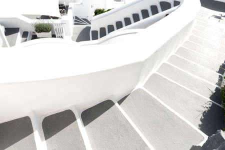 Oia town on Santorini island, Greece. Traditional and famous houses and churches with blue domes...