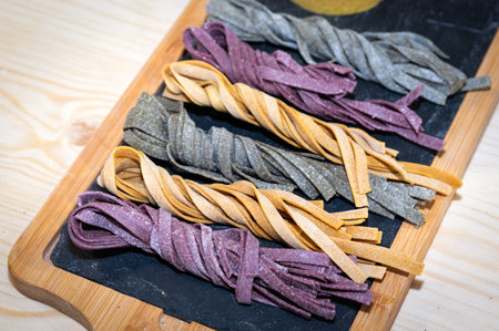 various varieties of pastas ready for be cookedの写真素材