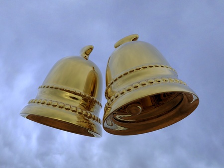 3d rendering of the gold bells in the skyの写真素材