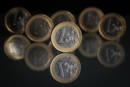 One euro coins on black background with backgroundの写真素材