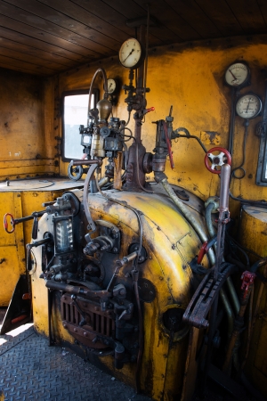 Yellow engine room on the steam locomotiveの写真素材