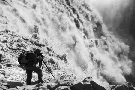 photographer taking picture of largest waterfall in Europe - Dettifoss from close distance, Iceland  black and white picture  の写真素材